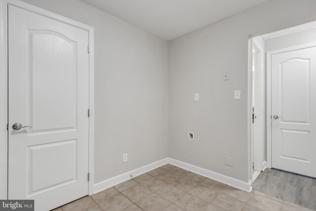 interior space with hardwood / wood-style flooring, a chandelier, and crown molding