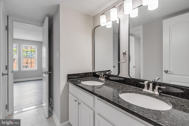 bathroom featuring hardwood / wood-style floors and vanity