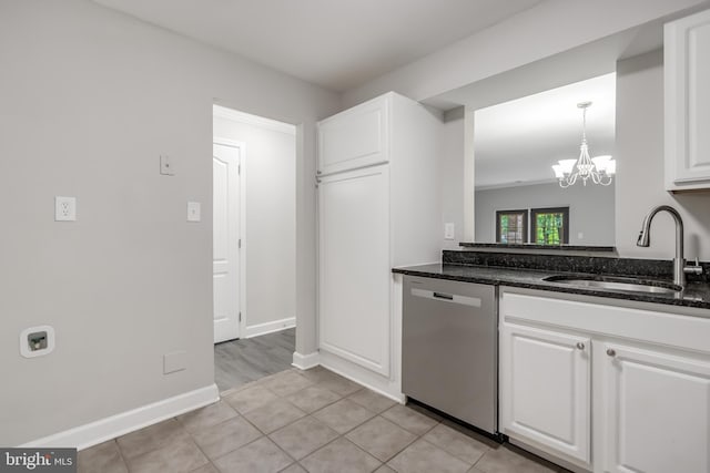 kitchen featuring white cabinetry, a chandelier, light tile patterned floors, dishwasher, and sink