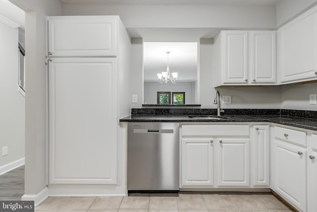 kitchen featuring white cabinets, an inviting chandelier, light hardwood / wood-style floors, sink, and stainless steel dishwasher