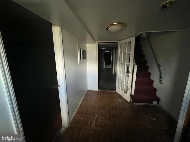 hall featuring dark parquet flooring