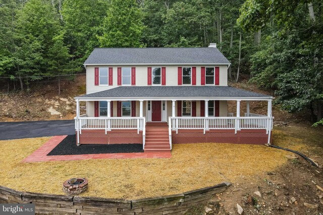 view of front of home featuring covered porch and central AC