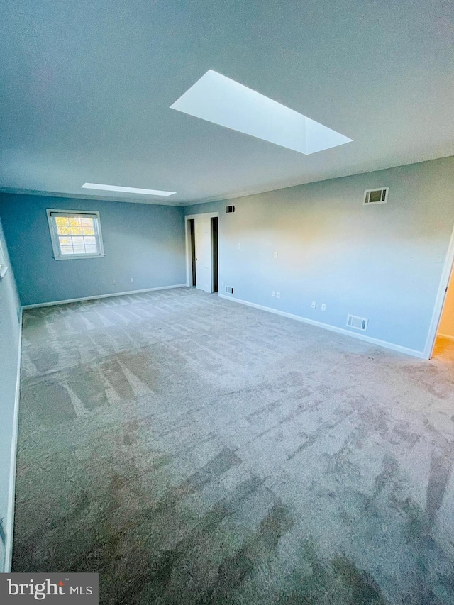 interior space featuring a textured ceiling and carpet floors