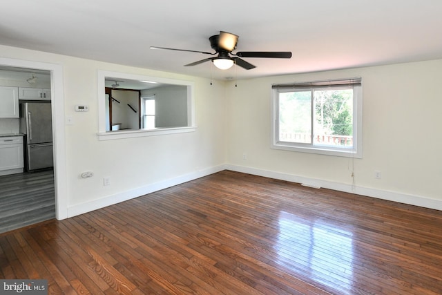 spare room with ceiling fan and hardwood / wood-style flooring