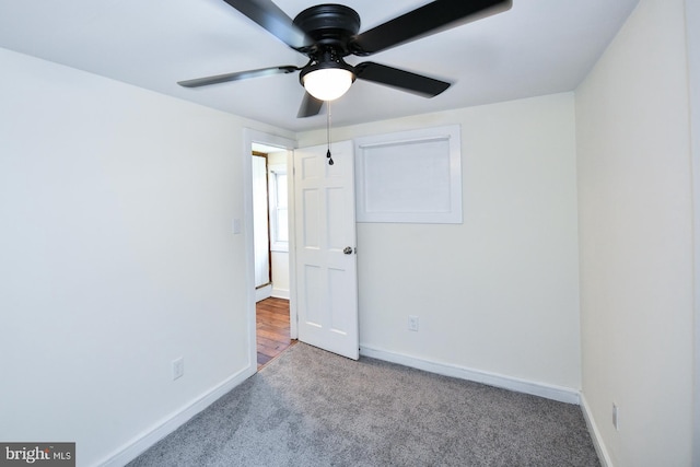 unfurnished bedroom featuring ceiling fan and carpet flooring