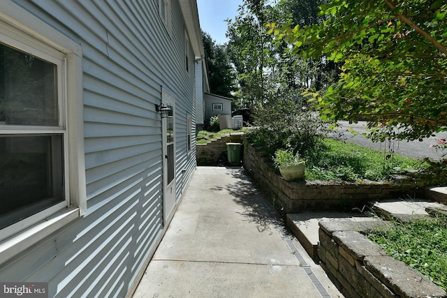 view of side of property featuring a patio area