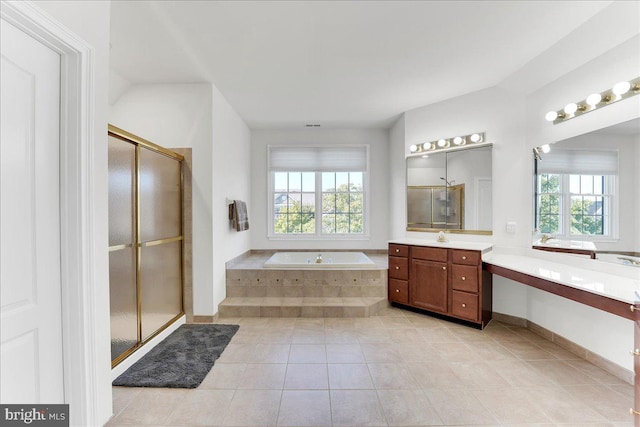 bathroom with vanity, tile patterned floors, separate shower and tub, and a wealth of natural light