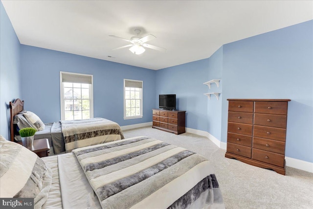 bedroom featuring ceiling fan and light colored carpet