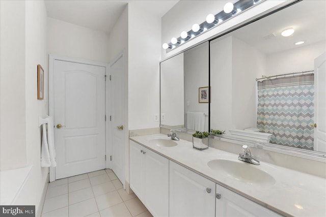 bathroom with tile patterned floors, a shower with curtain, and vanity