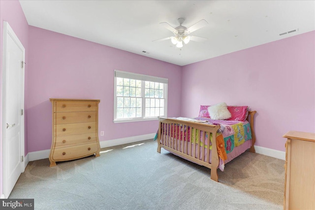 bedroom with ceiling fan and carpet floors