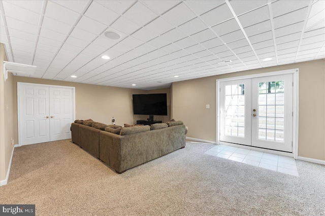 carpeted living room featuring french doors