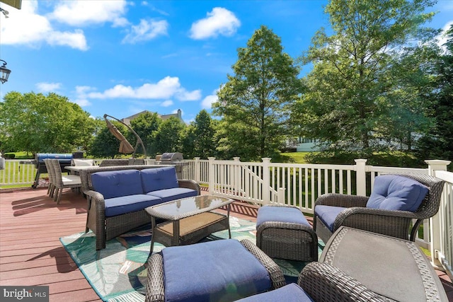 wooden deck with an outdoor living space