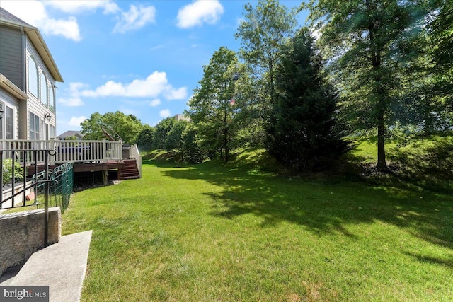 view of yard with a deck