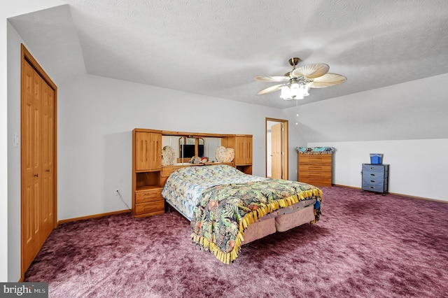 bedroom with carpet flooring, vaulted ceiling, a textured ceiling, and baseboards