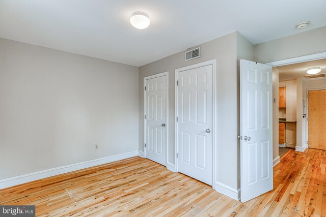 unfurnished bedroom with light hardwood / wood-style flooring