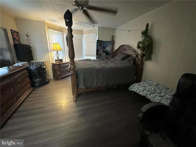 bedroom with ceiling fan and hardwood / wood-style flooring