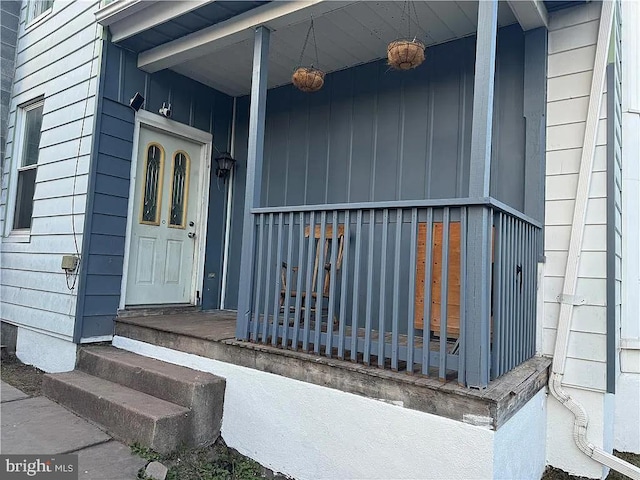 property entrance featuring covered porch