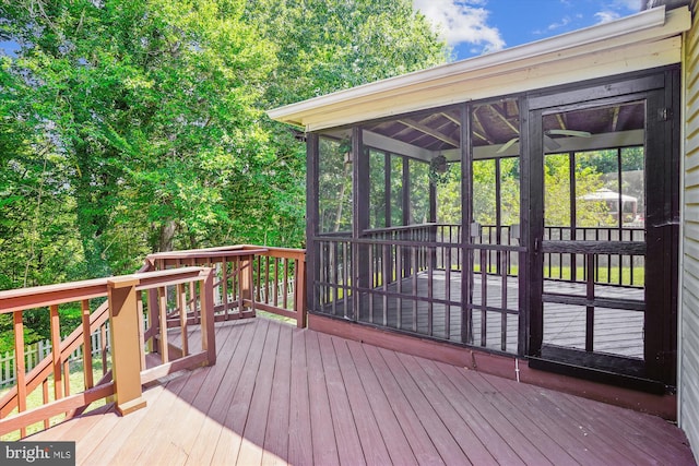 deck with a sunroom