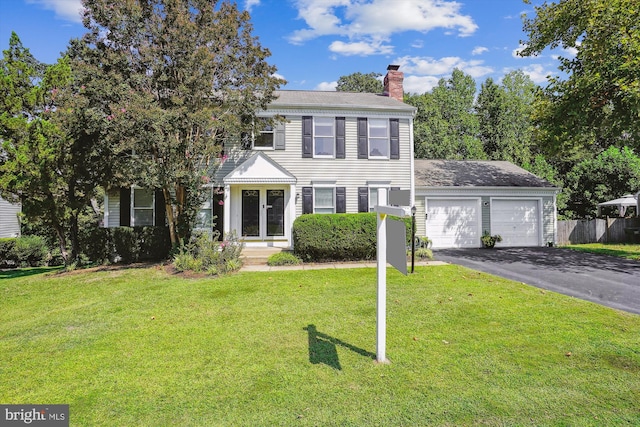 view of front facade with a garage and a front yard