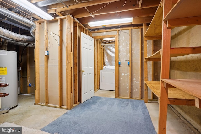 unfinished basement with washer / clothes dryer and water heater