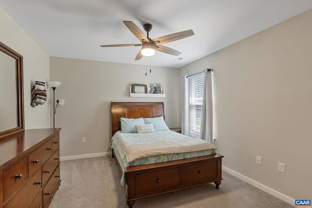 bedroom featuring ceiling fan and light colored carpet