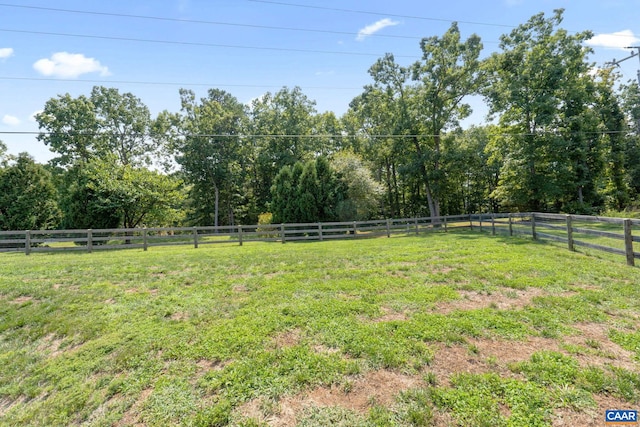 view of yard with a rural view