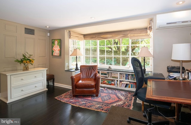 home office with baseboards, visible vents, dark wood-type flooring, a wall mounted AC, and recessed lighting