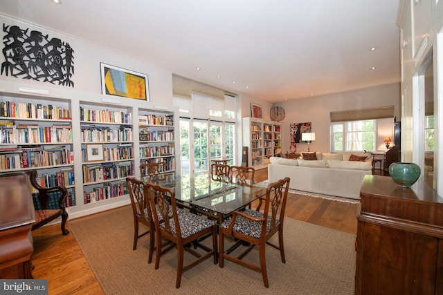 dining area with recessed lighting and wood finished floors