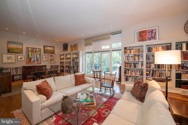 living room with wood finished floors and recessed lighting