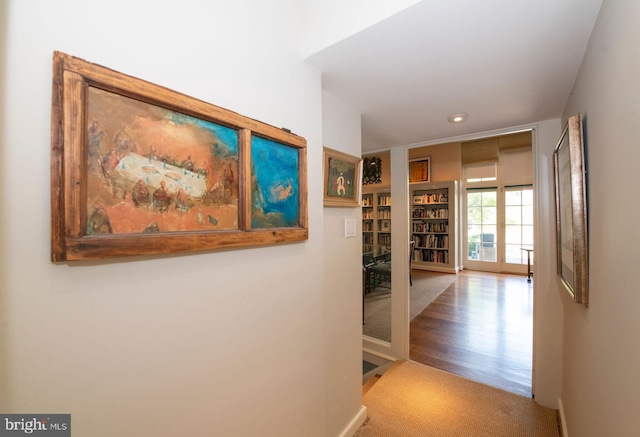 hall with carpet floors, recessed lighting, and baseboards