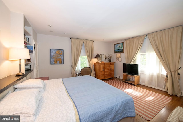 bedroom featuring wood finished floors