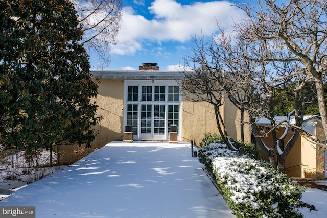 view of side of home featuring stucco siding