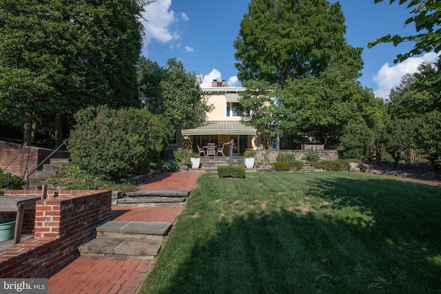 view of yard with covered porch