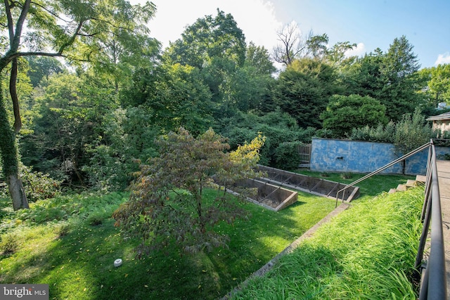 view of yard featuring a garden and fence