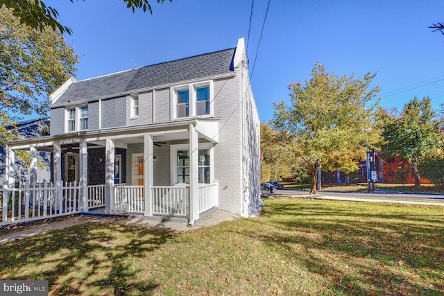 view of front of home featuring a porch and a front yard