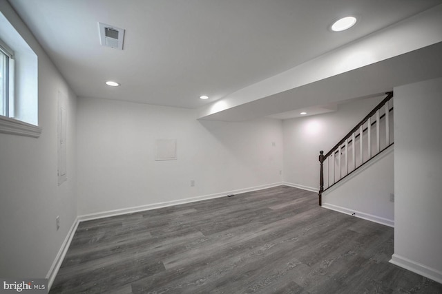 basement with dark wood-type flooring