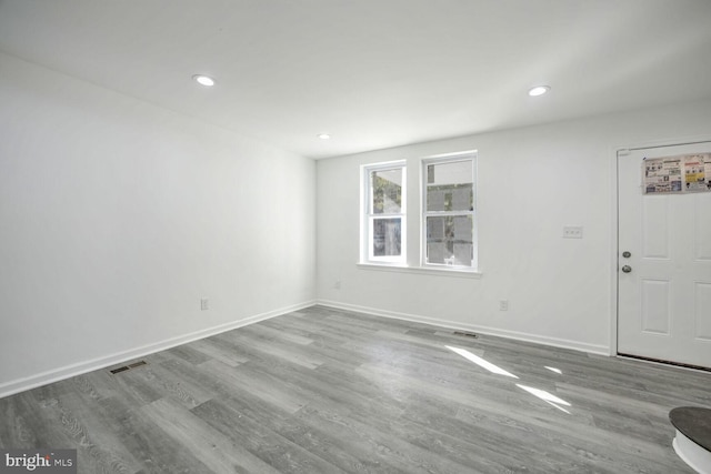 spare room with light hardwood / wood-style floors