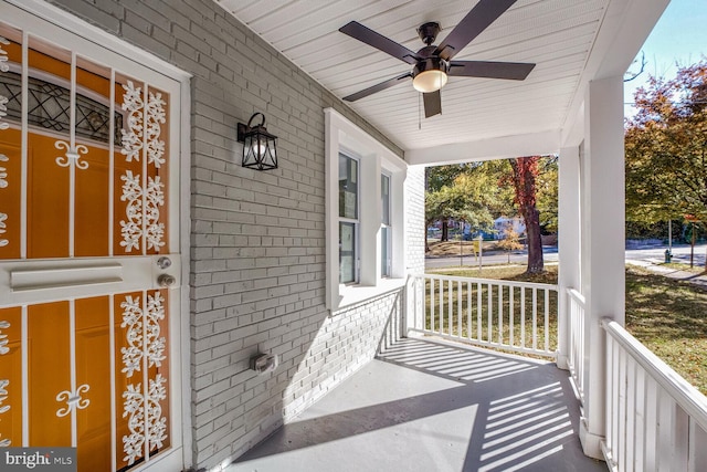 view of patio with ceiling fan and a porch