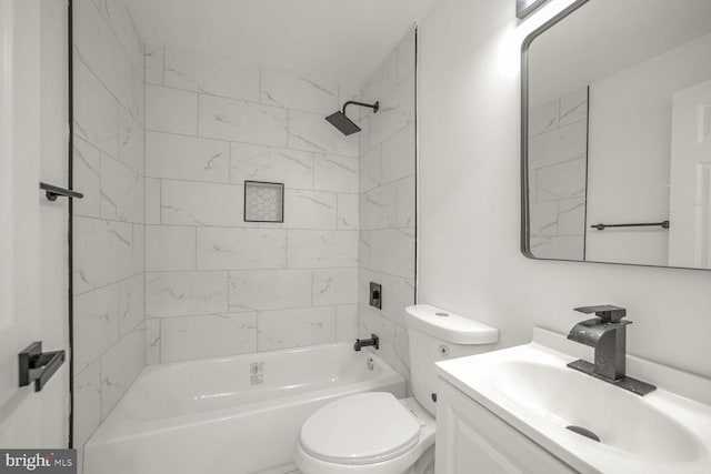 full bathroom with vanity, toilet, and tiled shower / bath