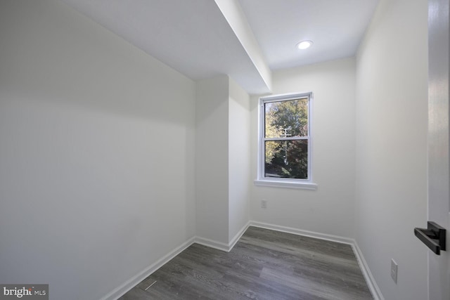 bonus room featuring dark wood-type flooring