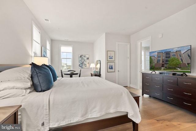 bedroom with light wood-type flooring