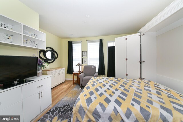 bedroom with light hardwood / wood-style flooring