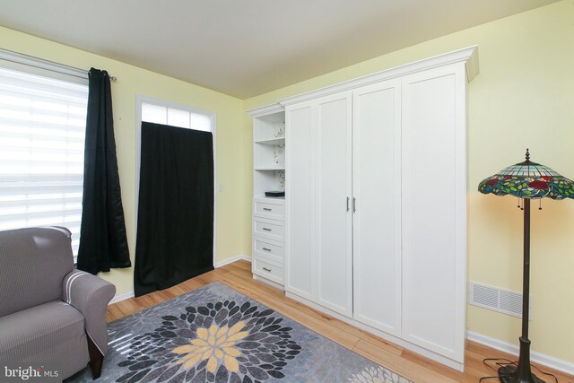 sitting room with light hardwood / wood-style flooring