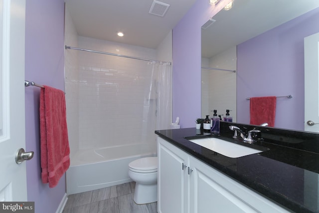 full bathroom with shower / bath combination with curtain, tile patterned flooring, toilet, and vanity