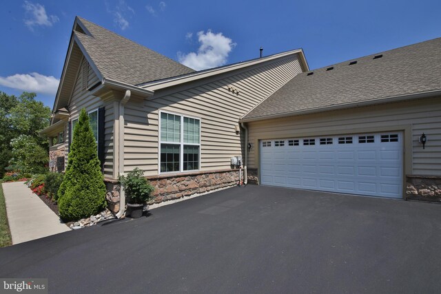 view of home's exterior with a garage