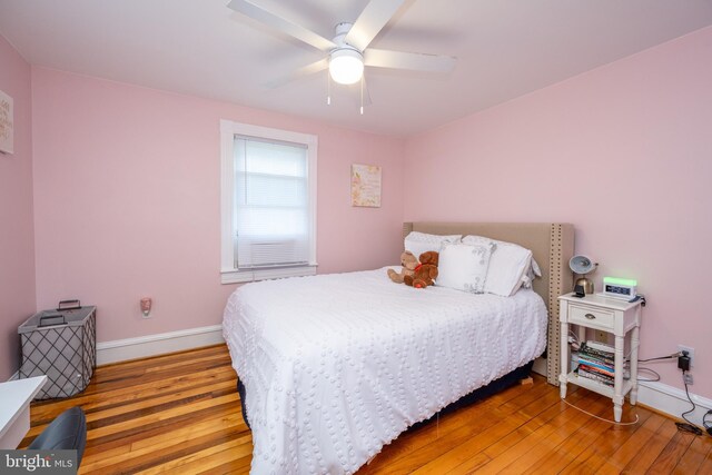 bedroom featuring light wood-type flooring and ceiling fan