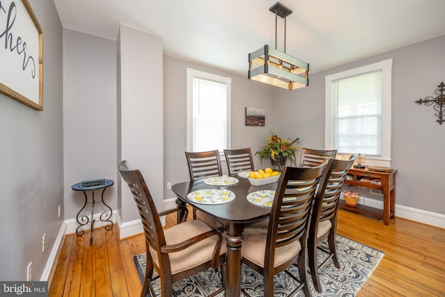 dining room with light wood-type flooring