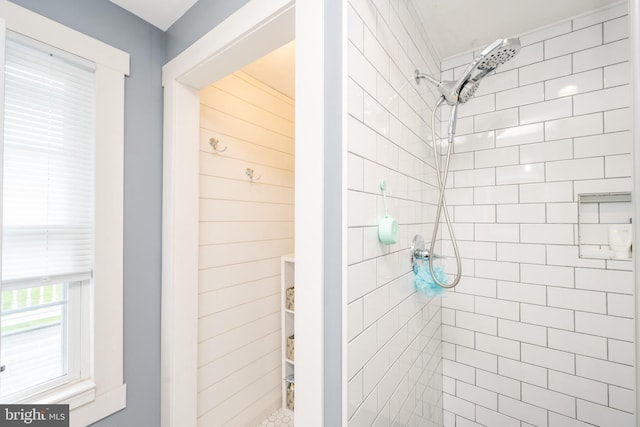 bathroom with a tile shower