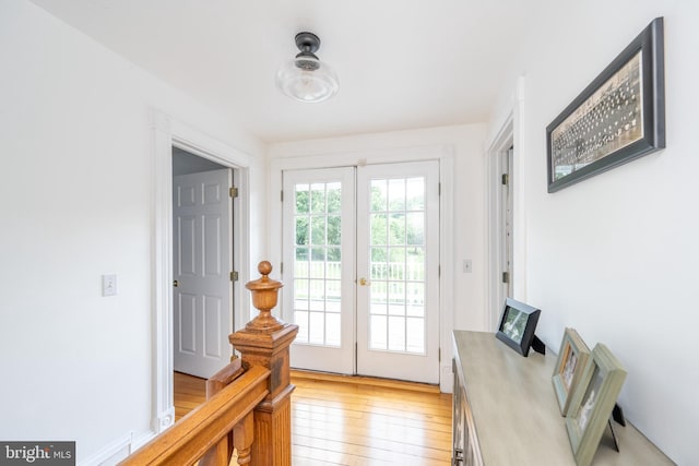 doorway to outside featuring light hardwood / wood-style flooring and french doors