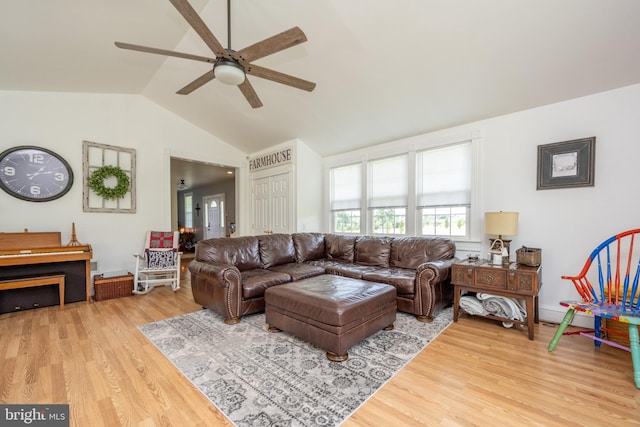 living room featuring lofted ceiling, ceiling fan, and light hardwood / wood-style floors